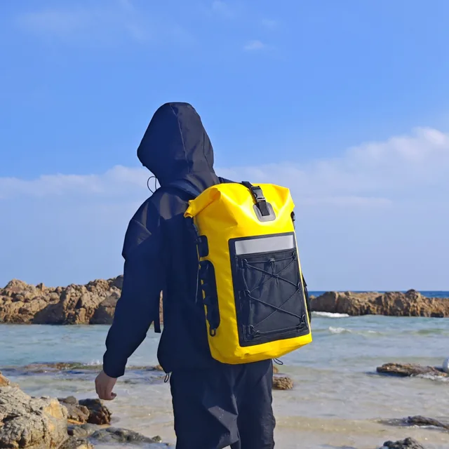 Yellow backpack worn while walking at the coast